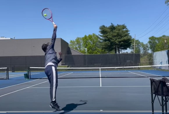 how to hit a kick serve: brush up on the ball